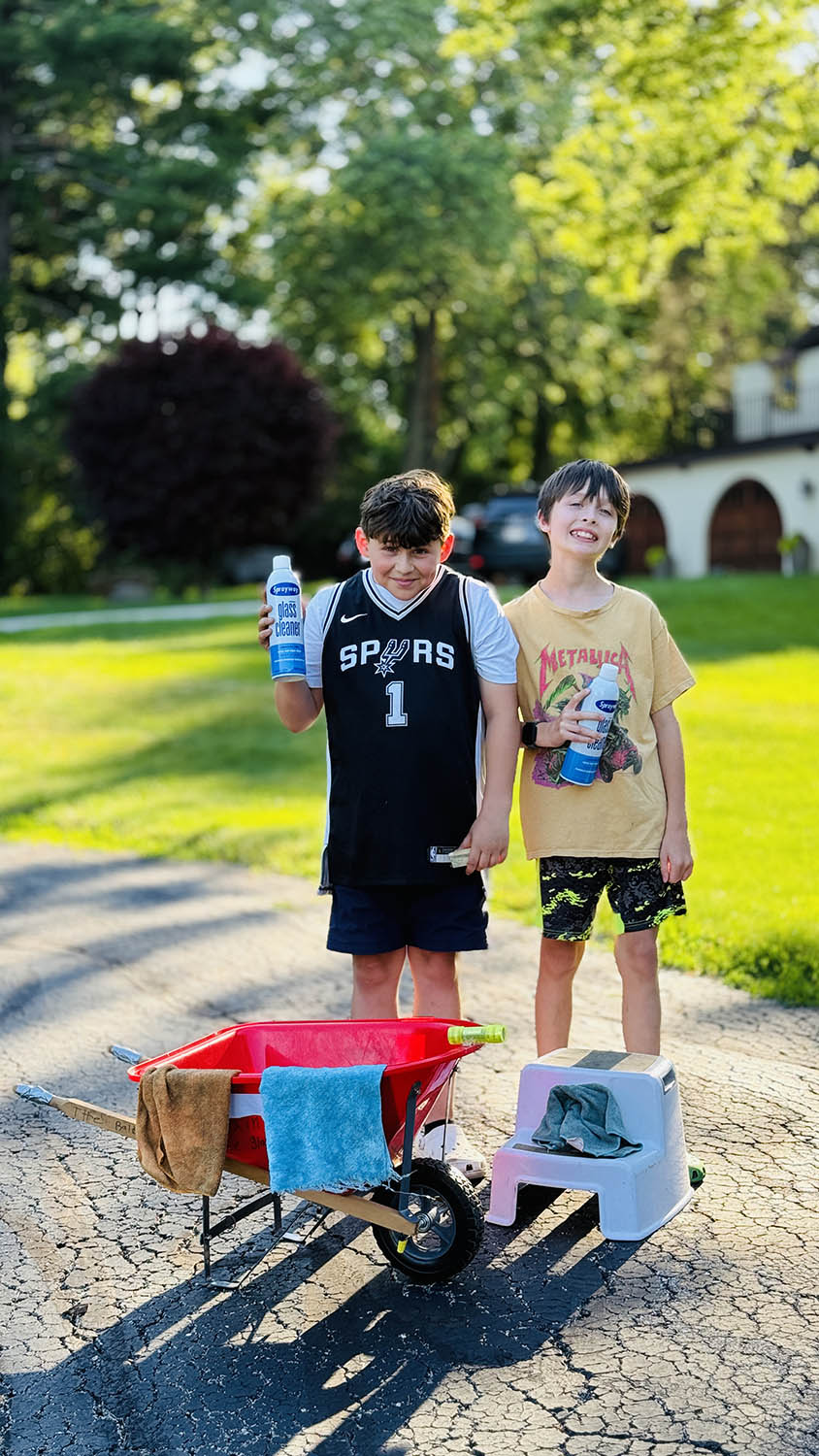 Preston and Grayson, the Glass Brothers, with squeegees ready to clean windows